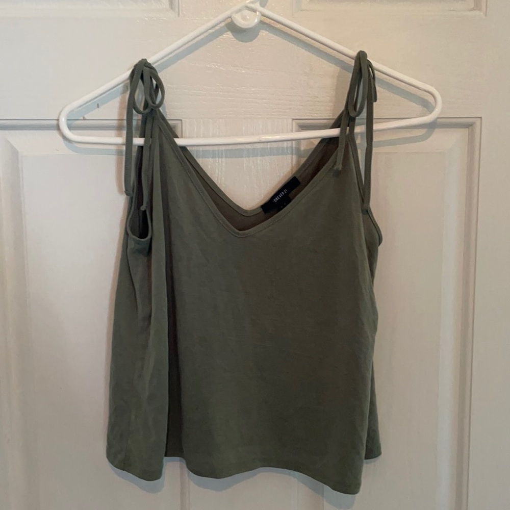 Soft green tank top with v neck cut on both sides
